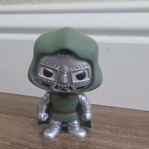 Green and Silver Collectible Figure